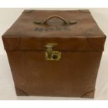 A vintage vulcanized fibre travelling case/trunk with leather carry handle.