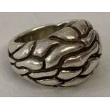 A silver bark design dome style ring. Marked 925 to inside of band.