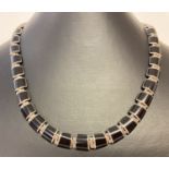 A modern design silver onyx set necklace with push clasp. Marked 950 Mexico to back of clasp.