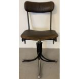 An early 20th century design metal framed office swivel chair with leatherette seat and back.