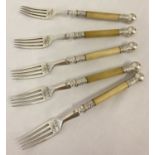 5 antique decorative forks with floral decoration, bone handles and ball finial to ends.