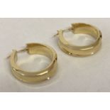 A pair of 9ct gold chunky hoop style earrings.