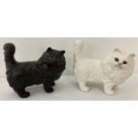 2 Beswick ceramic cat figurines, model No. 1898, in black and white matt finish.
