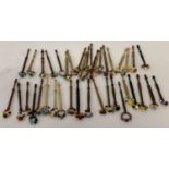 40 assorted beaded lacemaking bobbins with turned wooden handles.
