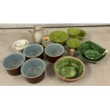 A box of vintage and modern ceramic serving bowls and table ware.