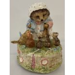 A Border Fine arts ceramic Beatrix potter musical figurine of Mrs Tiggy - Winkle with bird and mice.