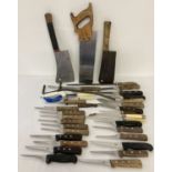 A large collection of vintage butchers knives, cleavers, sharpeners and domestic kitchen knives.