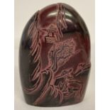 A 2 tone Oriental soapstone seal with carved mountainous scene front and back.