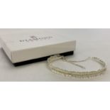 A boxed 925 silver and diamond feather design bracelet with extension safety chain.
