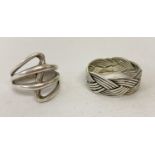 2 modern design silver dress rings.