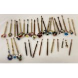 33 assorted beaded lacemaking bobbins with turned wooden handles.