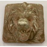 A vintage stoneware lions head garden wall plaque.