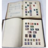 A vintage Acme Stamp Album containing British and British Empire George VI postage stamps in used