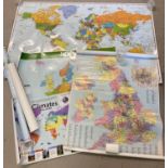 A collection of poster sized laminated wall maps of The World, Europe and The British Isles.