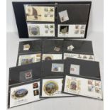 A folder of 34 British first day covers with either mint corresponding individual stamps or