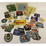 A collection of assorted advertising boxes, packaging and beer mats. To include matchboxes,