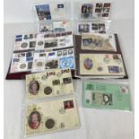 A folder of The Philatelic Numismatic Collection of first day stamp covers with coins and banks