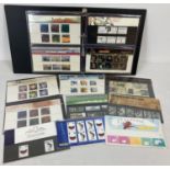 A brown folder containing 13 Royal Mail mint 2004 collectors stamp sets in original presentation