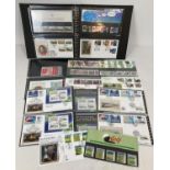 A blue folder containing a collection of 14 Royal Mail mint collectors stamp sets and stamp books