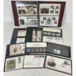 A Benham folder containing a collection of British definitive collectors stamp sets and