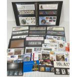 A Black folder containing 13 Royal Mail mint collectors stamp sets or stamp books complete with