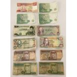 A collection of 12 assorted foreign bank notes. To include: Singapore, South Africa, Bolivia,