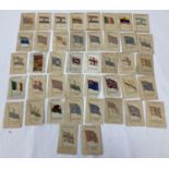 A collection of 41 Kensitas Cigarettes silk cigarette cards from the National Flags series and the