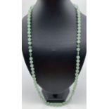 A modern design 30 inch pale green adventurine round and heart shaped bead necklace.