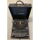 A vintage 1940's Remington Rand Portable typewriter complete with ribbons and original case. In good