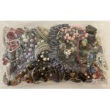 A sealed bag of mixed modern costume jewellery to include bracelets, bangles and necklaces.