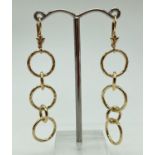 A pair of hammered design, multi circular link silver gilt drop style earrings by Veronese. Lever