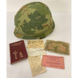 1960's Vietnam War era US M1 steel helmet with liner & camo cover and complete with chinstrap.
