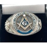 A men's Masonic style silver ring with compass & set square detail. Marked 925 to inside of band.