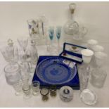 A collection of glass and crystal ware to include twist stem glasses, paperweights and vases. Lot