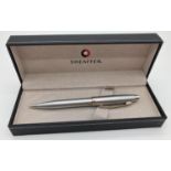 A boxed Sheaffer propelling pencil in a chrome brushed silver tone finish.