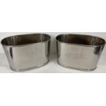 A pair of large Bollinger Champagne buckets with engraved details to sides. One side is engraved
