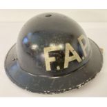 WW2 British MkII steel helmet, painted black for Home Front use, stencilled in white 'FAP'. First