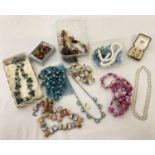 A collection of vintage jewellery necklaces and earrings to include glass, natural stone and