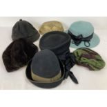 A small collection of vintage hats to include examples from Kangol.