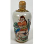 A Chinese ceramic snuff bottle with erotic scene painted to front. Signature mark to base. Approx.
