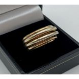 A contemporary design silver gilt dress ring in a domed multi ring design. Size L.