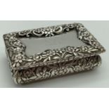 A Nathaniel Mills Georgian Silver snuff box with decoratively engraved floral detail to lid &
