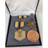 A boxed US Air Force Military Merit medal with ribbon and enamel pin bar. Together with a WWII