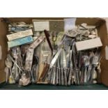 A box of assorted modern and vintage cutlery to include Viners and Walker & Hall. Lot includes boxed