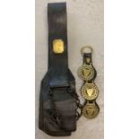 A vintage heavy leather horse strap with chains and brass plaques together with a strap containing 3