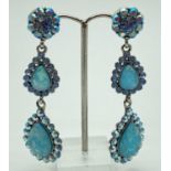 A pair of costume jewellery drop style earrings by Butler & Wilson. Blue oval cut faux opalite