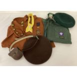 A vintage 1970's Brownie uniform and cub scout shirt and beret together with a quantity of badges.