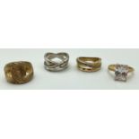 4 silver and silver gilt dress rings. 2 x cross over designs set with clear stones, an emerald cut