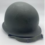 Vietnam War era US Paratrooper M1C steel helmet with helmet shell rim jointed at front. First