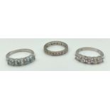 3 silver stone set dress rings. A full eternity ring set with DQCZ stones, a half eternity ring
